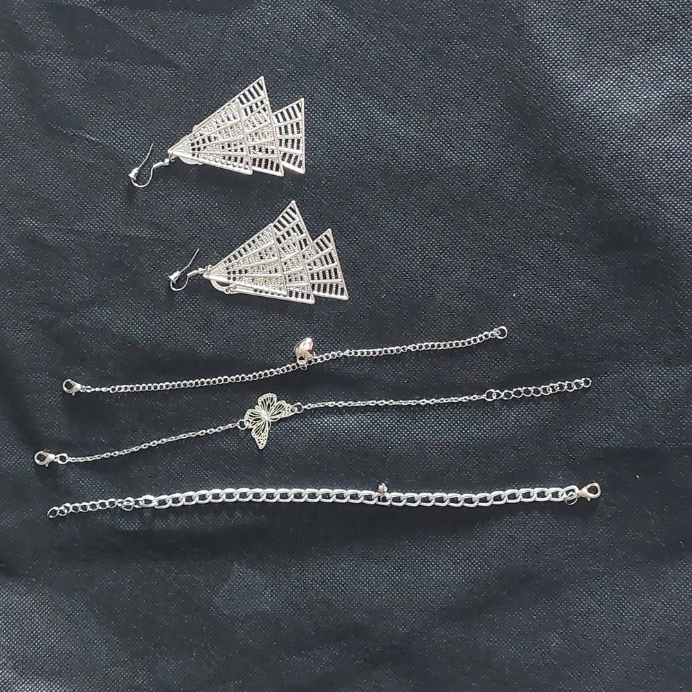Silver earrings and 3 added accessories.